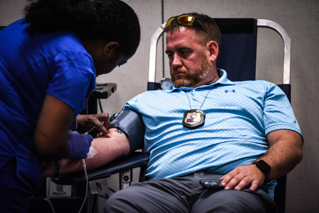 an SBPD officer donating blood
