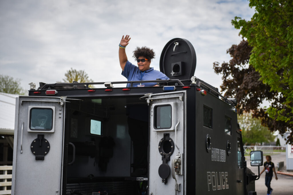A woman stands inside a South Bend Police Department van