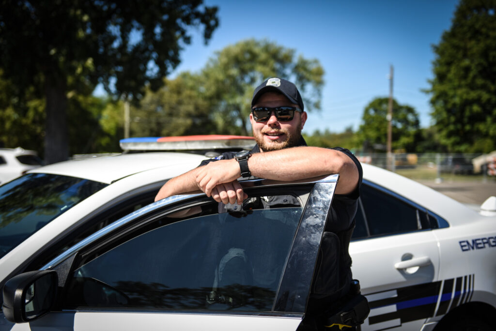 an SBPD officer getting out of a police car