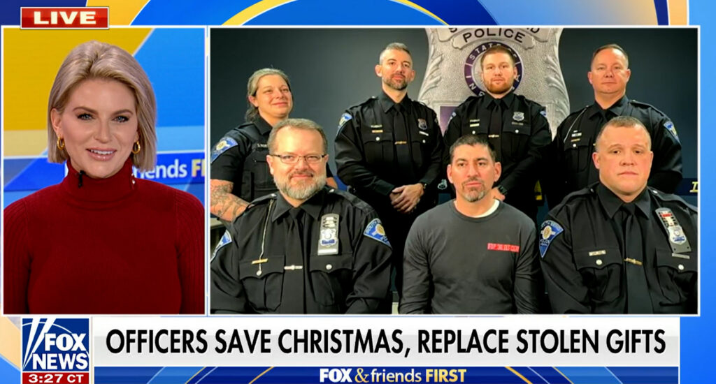 a screenshot from a Fox News program showing south bend officers with a newscaster. The caption says "Officers save Christmas, Replace Stolen Gifts"